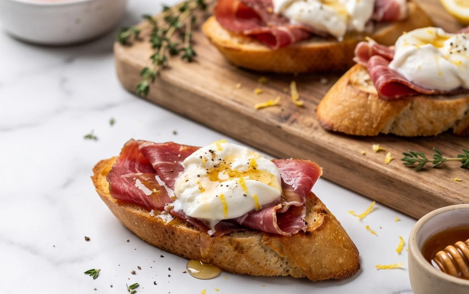 Beef Prosciutto Crostini with Burrata and Lemon Honey Drizzle